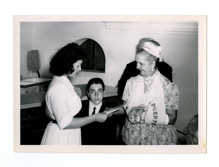 San Juan mayor Felisa Rincón de Gautier (1897-1994) meets Puerto Rican young adults while she visits Philadelphia